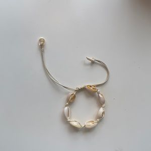 Adjustable shell bracelet/anklet with a necklace.